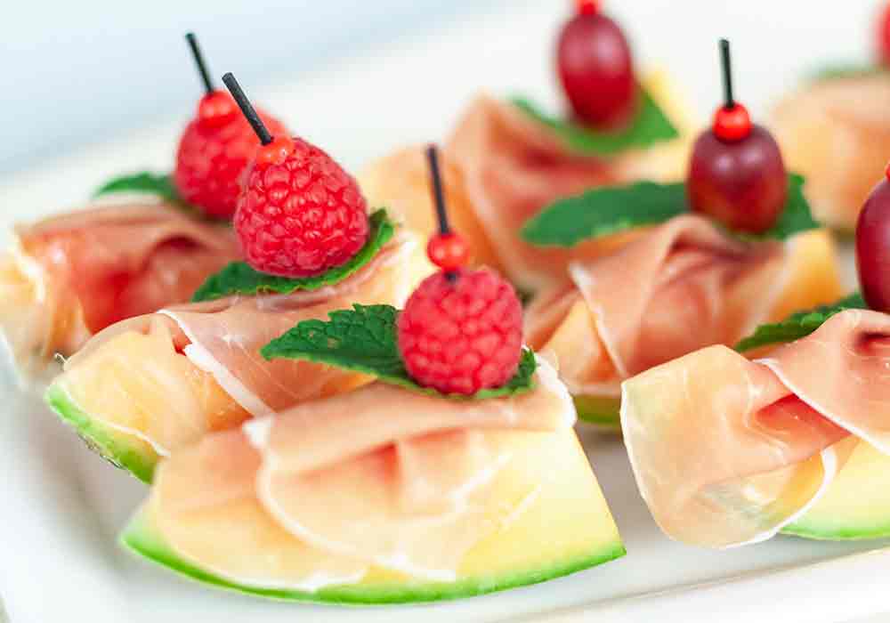 Melonenschiffchen mit Schinken, ab 12 Stk.